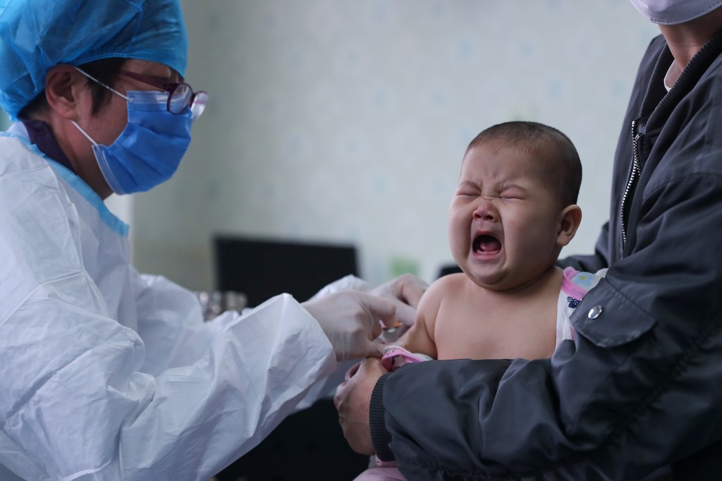 A six-month-old baby receives a vaccine at a health centre. Vaccines remain one of the most effective tools in global health by preventing the spread of deadly infectious diseases.